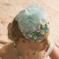 Button cocktail hat with organza flowers