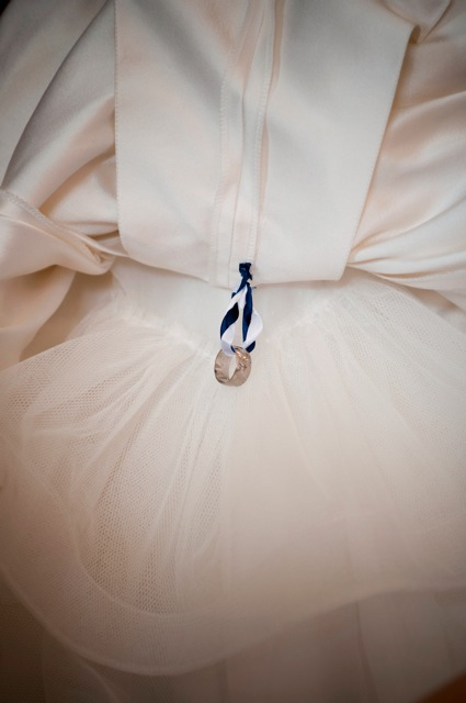 The Bride's Mothers Wedding ring, sewn in to the dress, what a beautiful touch...