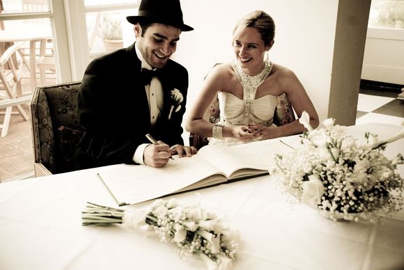 Georgina and Riccardo signing the Register...