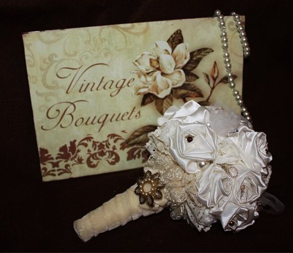 A Jo Barnes Vintage Bouquet - crafted out of vintage fabric, feathers, crystals, pearls and vintage jewellery pieces...