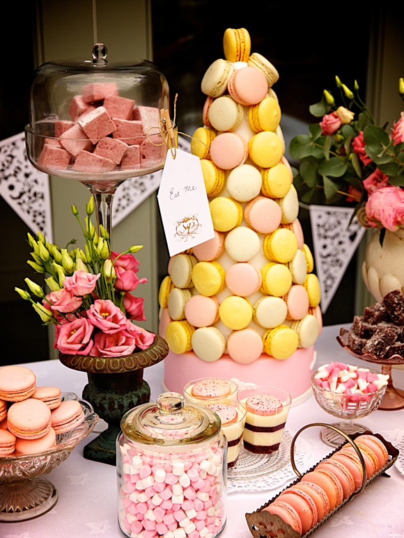 pink dessert and sweet buffet with a central Macaron Croquembouche