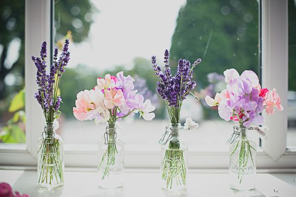 pretty pastel wedding flowers in glass jars