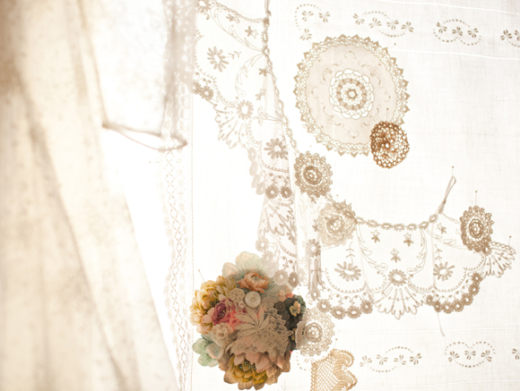 Lace window with oversized brooch - image credit www.beckymitchell.co.uk