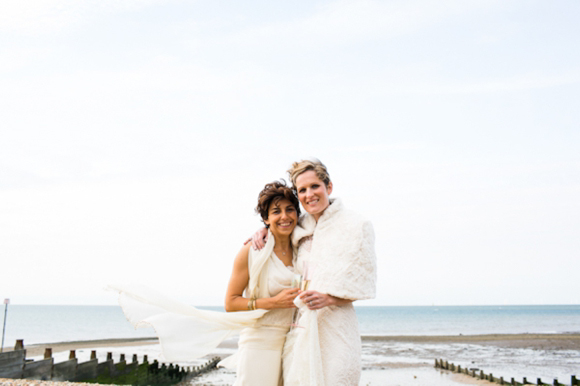 Civil Partnership, Whistable Beach, with wedding dresses by Sally Lacock...
