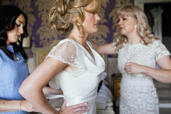 Bride wearing a dress by The Vintage Wedding Dress Company for her vintage wedding