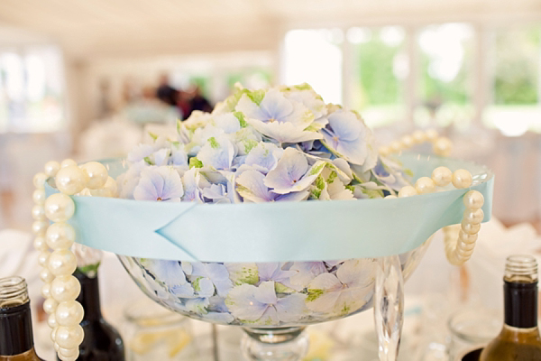 Stewart Parvin wedding dress and pale blue hydrangea wedding bouquets
