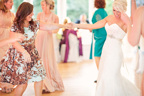 Stewart Parvin wedding dress and pale blue hydrangea wedding bouquets