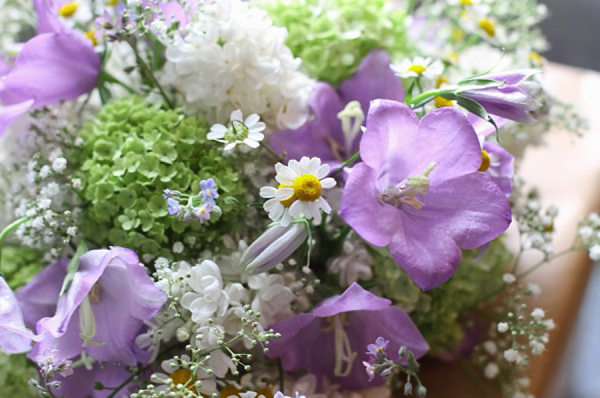 Pale blue Belle and Bunty wedding dress and flowers in her hair