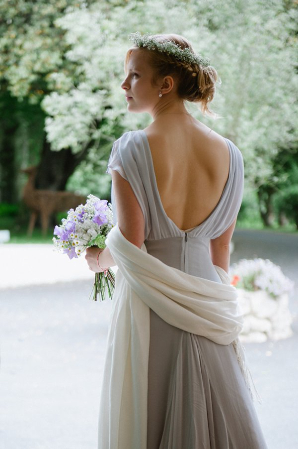 Pale blue Belle and Bunty wedding dress and flowers in her hair