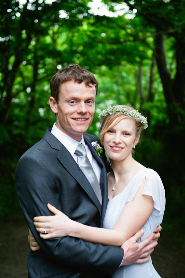 Pale blue Belle and Bunty wedding dress and flowers in her hair