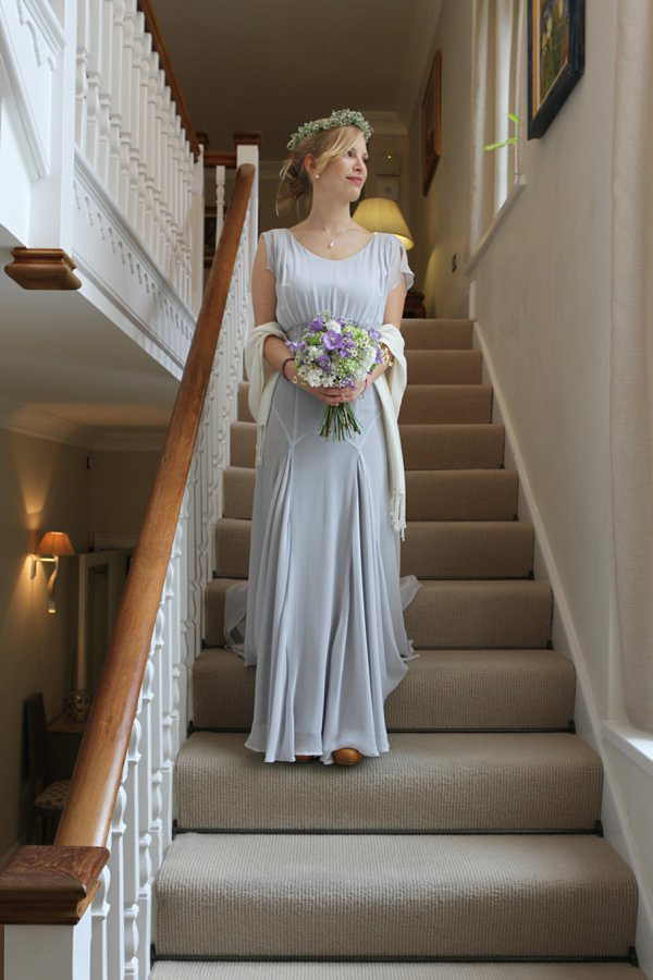 Pale blue Belle and Bunty wedding dress and flowers in her hair