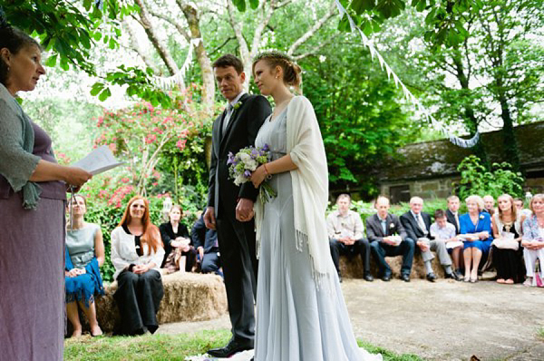 Pale blue Belle and Bunty wedding dress and flowers in her hair