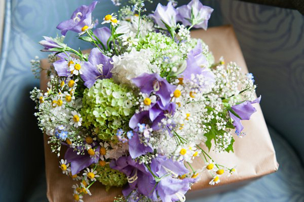 Pale blue Belle and Bunty wedding dress and flowers in her hair