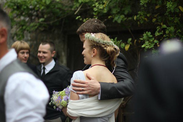 Pale blue Belle and Bunty wedding dress and flowers in her hair