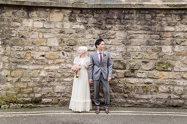 A bride wearing her Mums 1980s wedding dress with photography by Kirsten Mavric