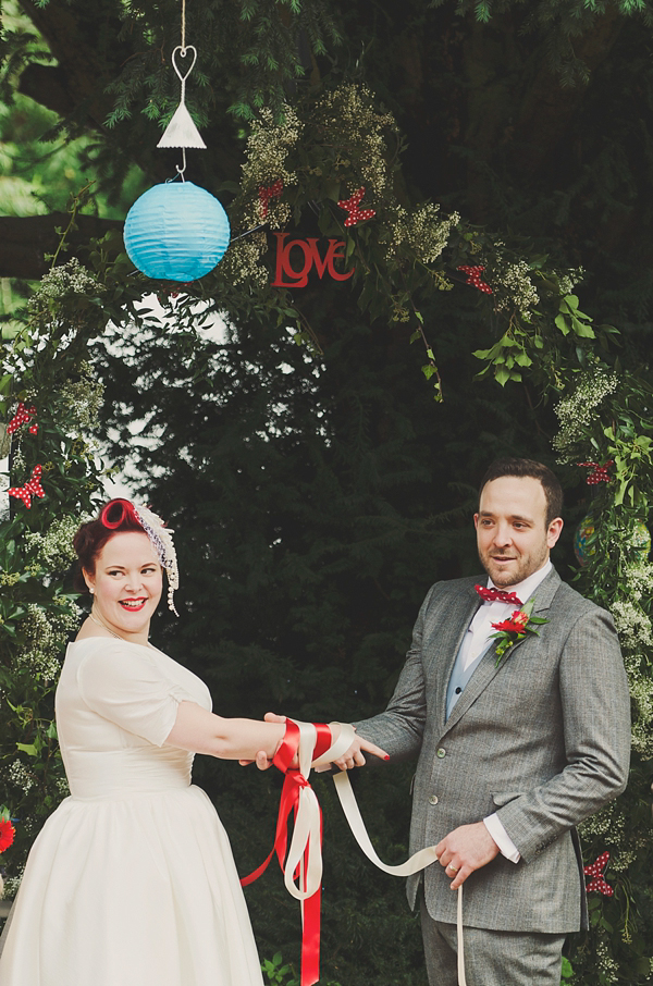 Hand fasting colourful outdoor wedding