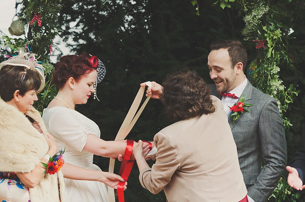 Hand fasting colourful outdoor wedding