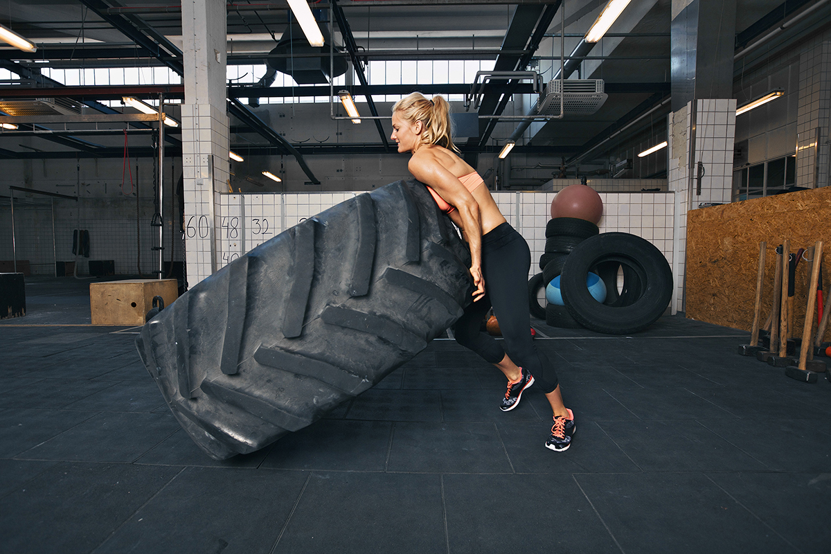 tyre flipping crossfit woman gym